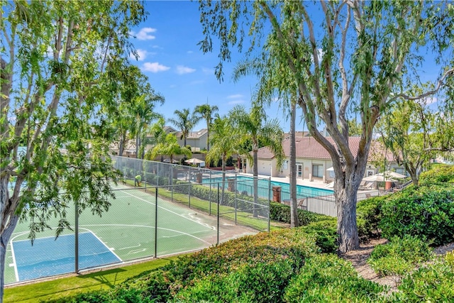 view of sport court featuring basketball hoop