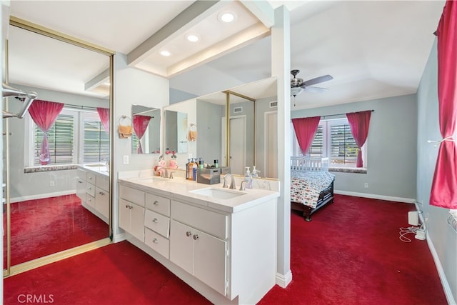 bathroom with ceiling fan, plenty of natural light, and vanity