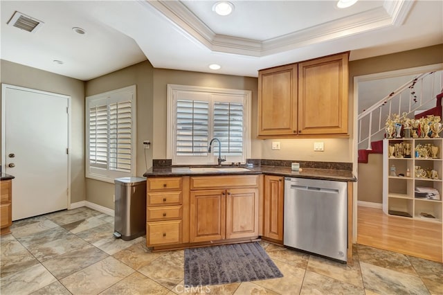 kitchen featuring ornamental molding, dishwasher, a tray ceiling, and sink