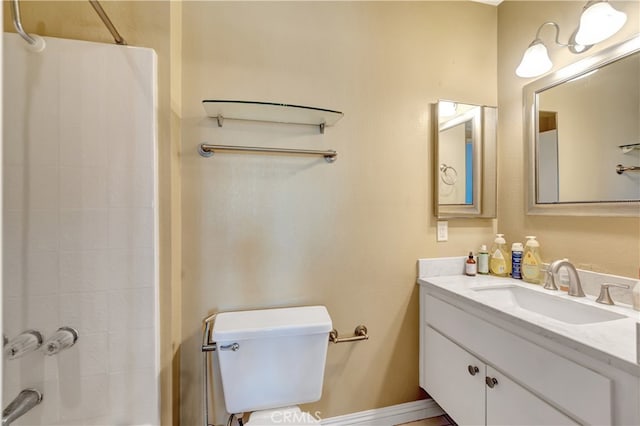 bathroom with vanity, toilet, and a shower with shower curtain