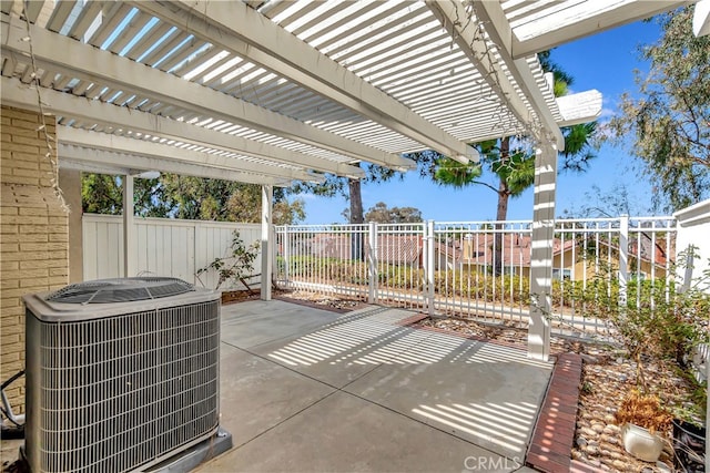 view of patio / terrace with a pergola and central AC unit