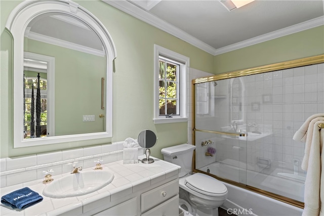 full bathroom with backsplash, ornamental molding, enclosed tub / shower combo, vanity, and toilet