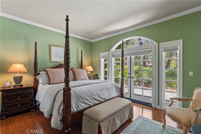 bedroom with ornamental molding, multiple windows, access to outside, and dark hardwood / wood-style flooring