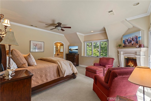 carpeted bedroom with ornamental molding and ceiling fan