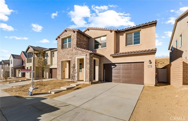 21239 W Wildflower Way, Chatsworth, CA 91311 - view of front of home featuring driveway, a tiled roof, a garage, stucco siding, and a residential view