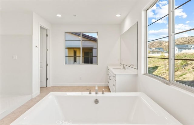 21239 W Wildflower Way, Chatsworth, CA 91311 - full bath with vanity, healthy amount of natural light, a freestanding tub, and recessed lighting