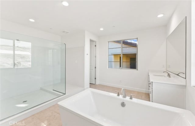 21239 W Wildflower Way, Chatsworth, CA 91311 - full bath featuring a freestanding tub, double vanity, healthy amount of natural light, and recessed lighting