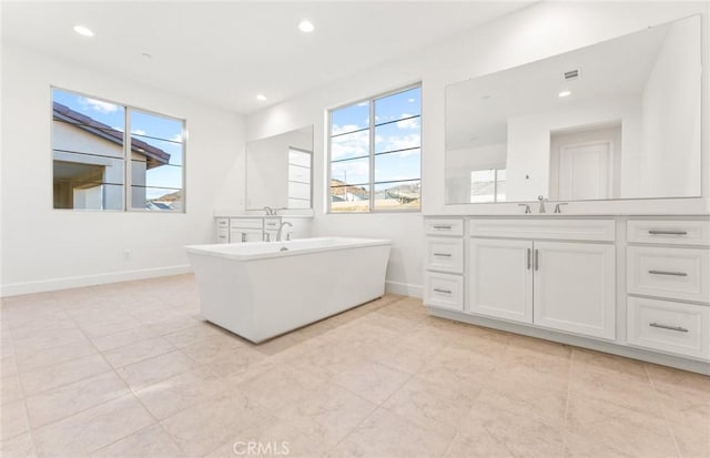 21239 W Wildflower Way, Chatsworth, CA 91311 - bathroom with a freestanding tub, vanity, recessed lighting, and tile patterned floors