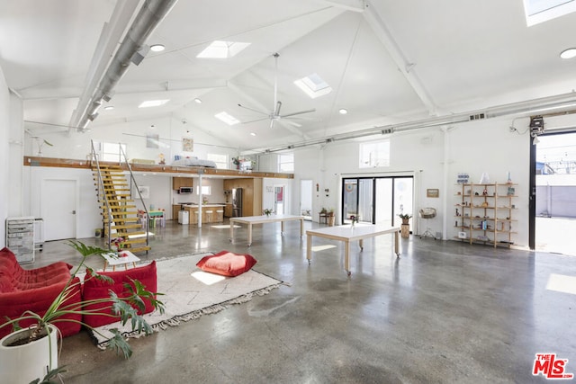 garage featuring ceiling fan and stainless steel fridge