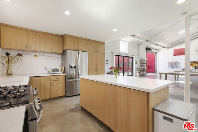 kitchen with light brown cabinets, sink, backsplash, stainless steel appliances, and a center island