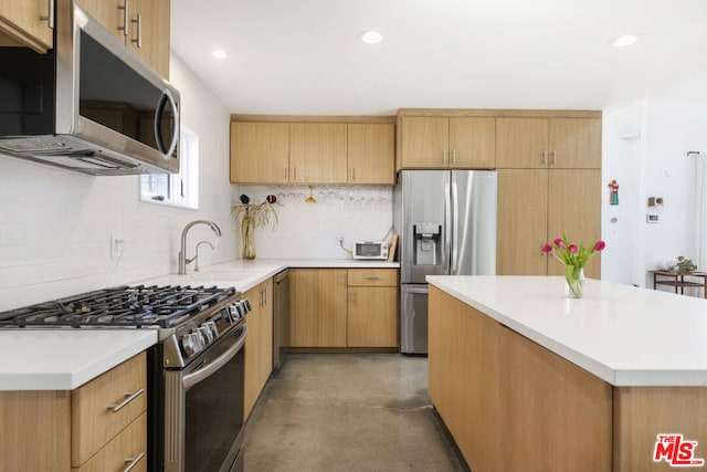 kitchen with appliances with stainless steel finishes, light brown cabinets, sink, and tasteful backsplash