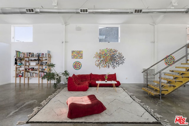 living room featuring concrete floors