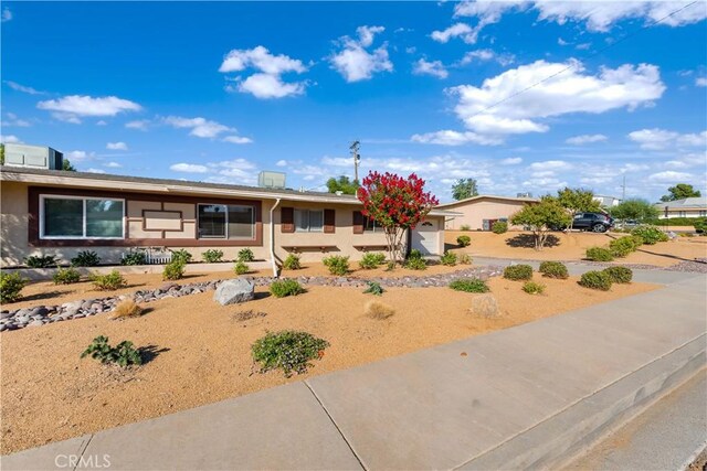 ranch-style house featuring a garage