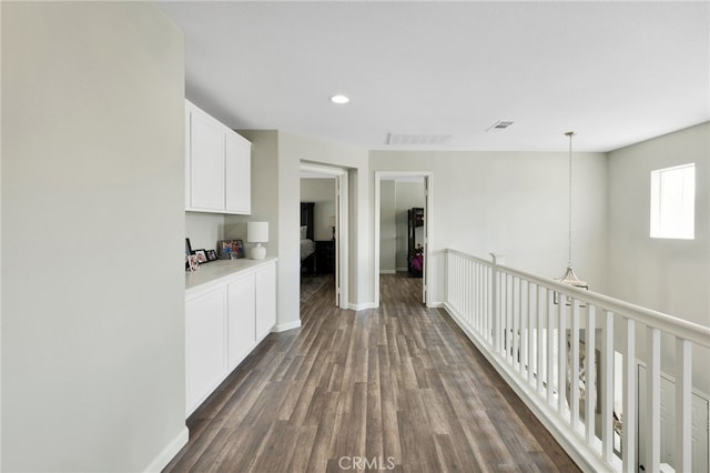 hall with dark wood-type flooring