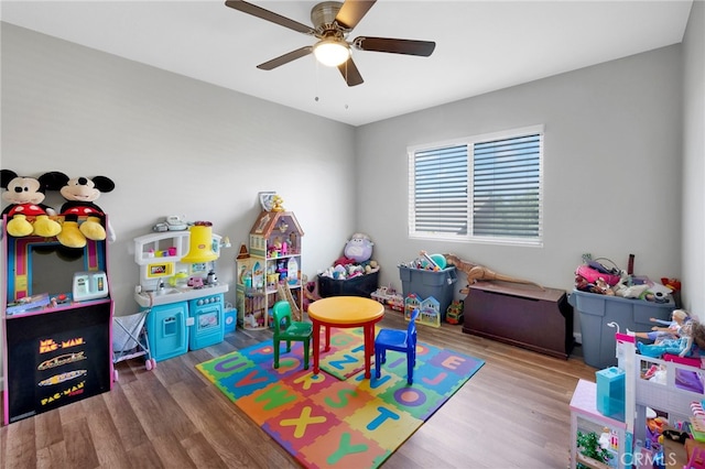 game room with wood-type flooring and ceiling fan