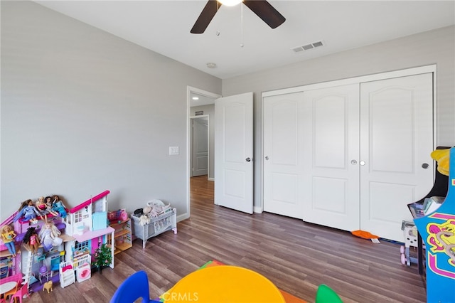 game room featuring ceiling fan and dark hardwood / wood-style floors