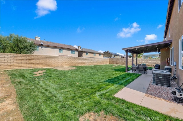 view of yard with cooling unit, a pergola, and a patio area