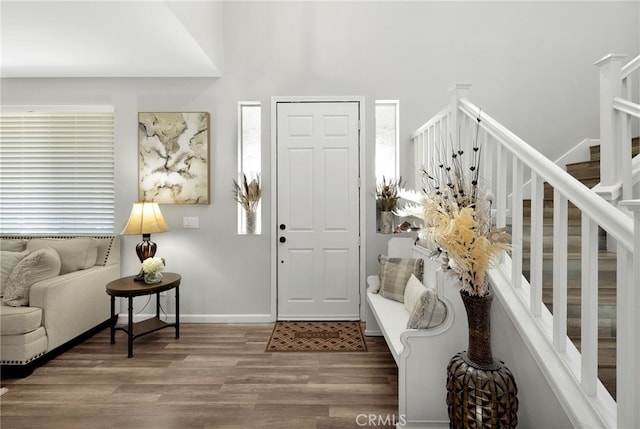 entryway with hardwood / wood-style floors