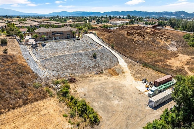 birds eye view of property with a mountain view