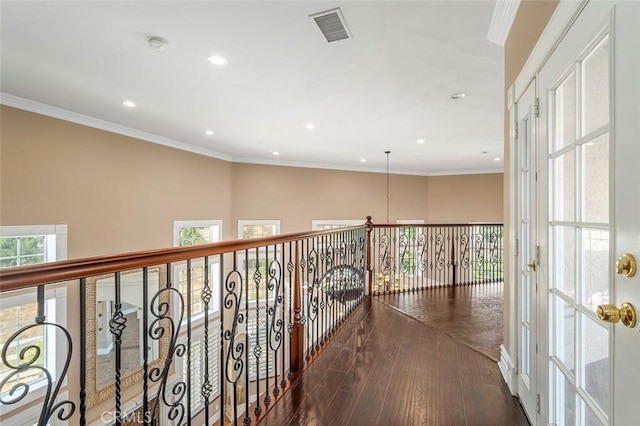 corridor with dark hardwood / wood-style flooring and crown molding