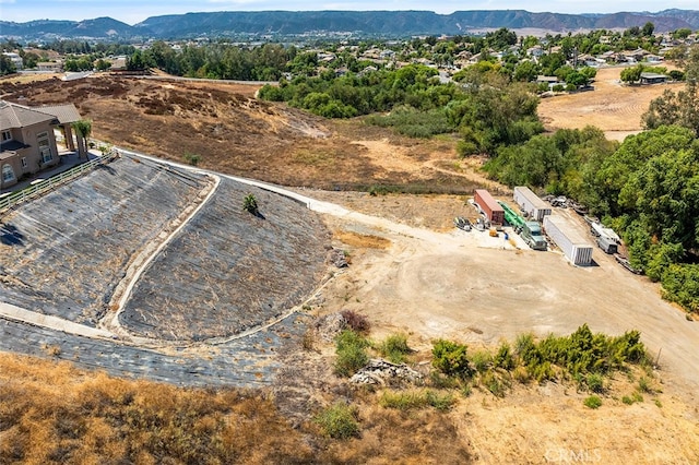 birds eye view of property with a mountain view