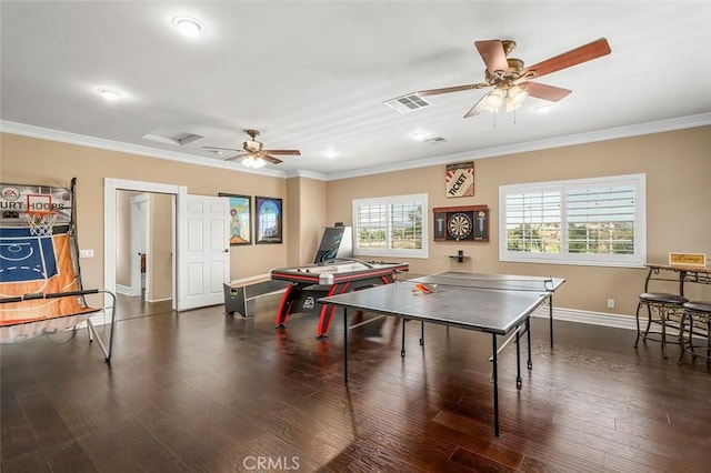 game room featuring ornamental molding, ceiling fan, and dark wood-type flooring