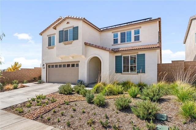 mediterranean / spanish-style house featuring a garage