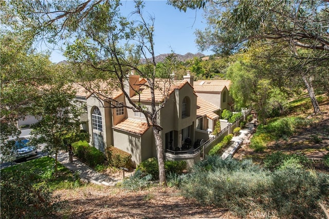 view of property exterior featuring a mountain view