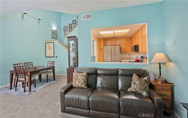 living room with light colored carpet