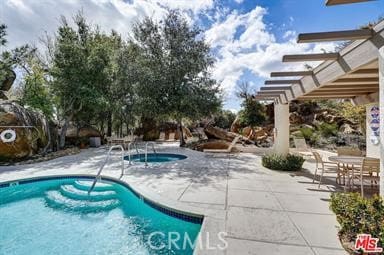 pool with a patio area