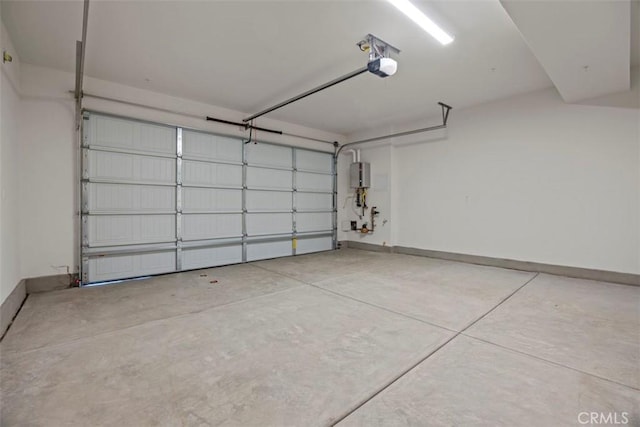 garage featuring water heater and a garage door opener