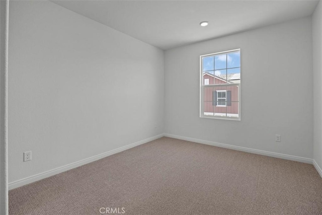 empty room featuring carpet flooring