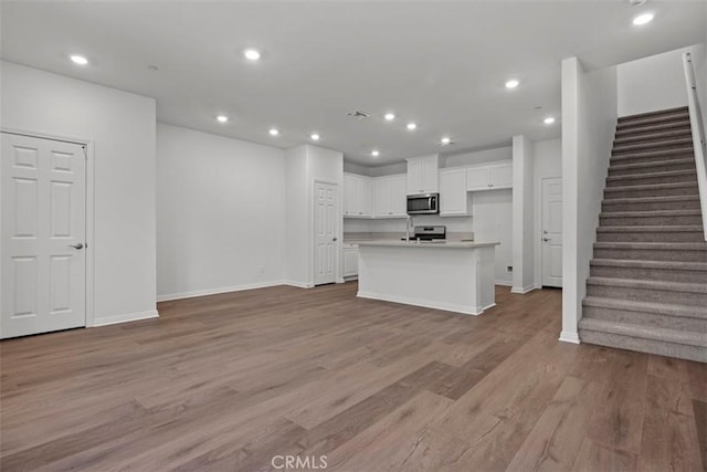 unfurnished living room with light hardwood / wood-style floors