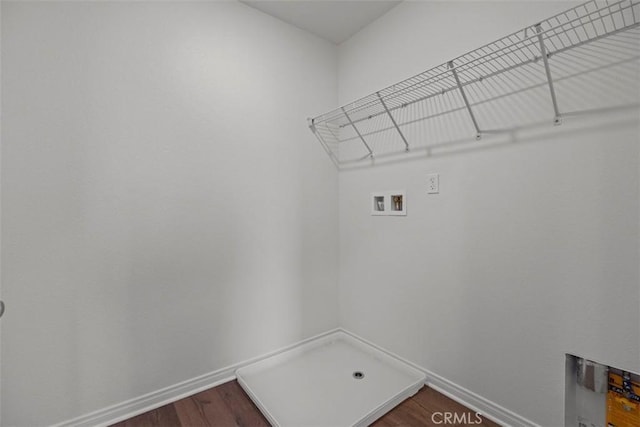 laundry area featuring hookup for a washing machine and hardwood / wood-style floors