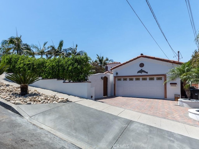 view of front of property featuring a garage