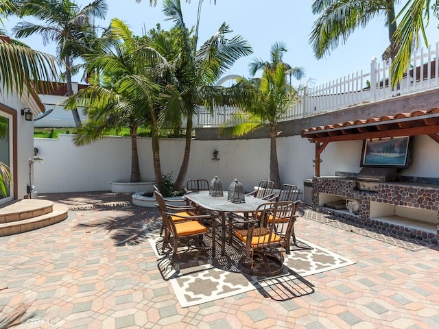 view of patio / terrace featuring a fireplace