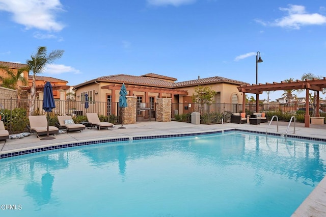 view of swimming pool with a pergola and a patio area