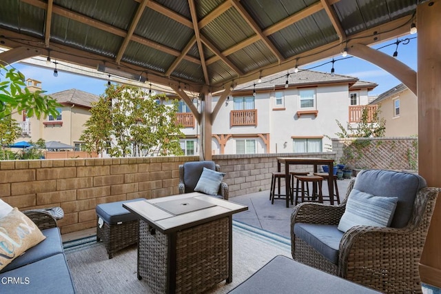 view of patio with a gazebo, an outdoor hangout area, and an outdoor bar