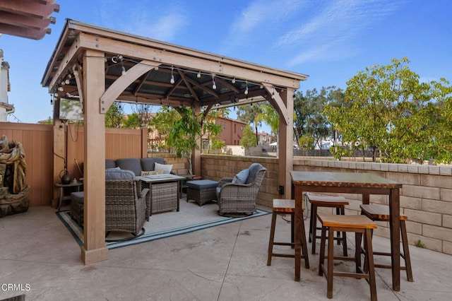 view of patio featuring a gazebo and an outdoor hangout area