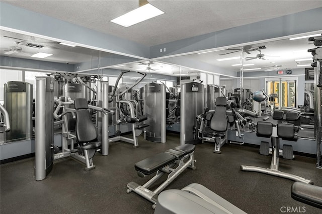 workout area featuring a textured ceiling