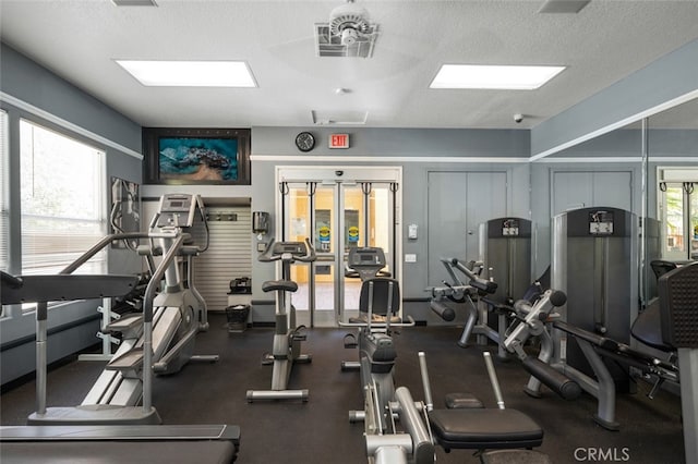 workout area with a textured ceiling