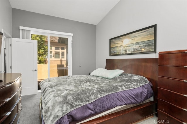 bedroom featuring vaulted ceiling, access to exterior, and carpet flooring