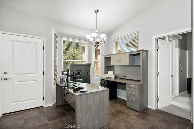 office space featuring vaulted ceiling, a chandelier, and dark tile patterned flooring