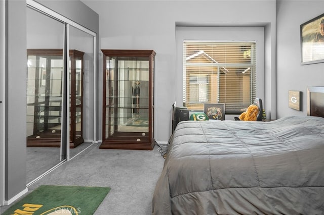 bedroom featuring carpet floors, multiple windows, and a closet