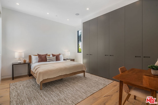 bedroom with light hardwood / wood-style floors