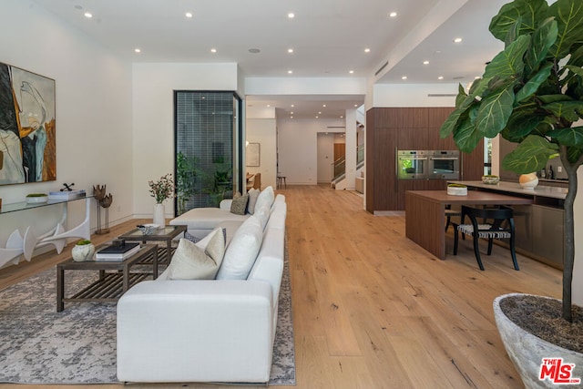 living room featuring light wood-type flooring