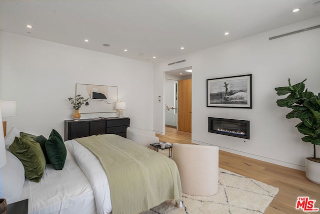 bedroom with light wood-type flooring