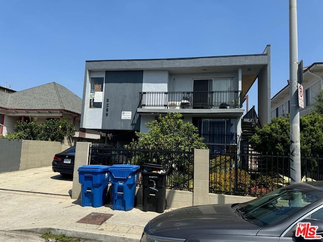 view of front of home with a balcony