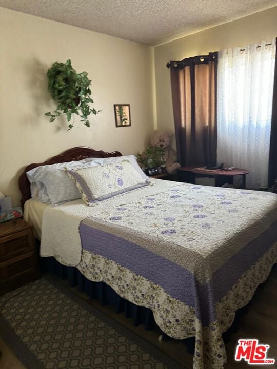 bedroom featuring a textured ceiling