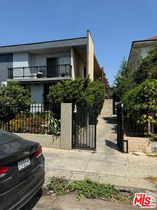 view of front of property with a balcony